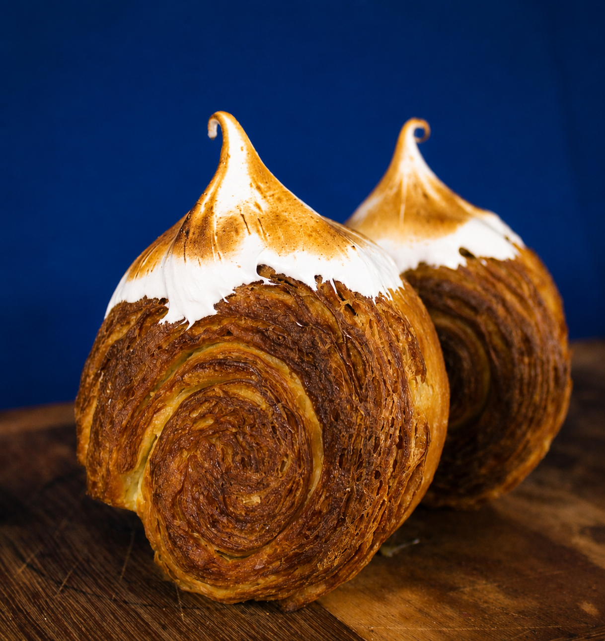 Two Lemon Meringue filled circular croissants with golden torched meringue tops | Dough Couture