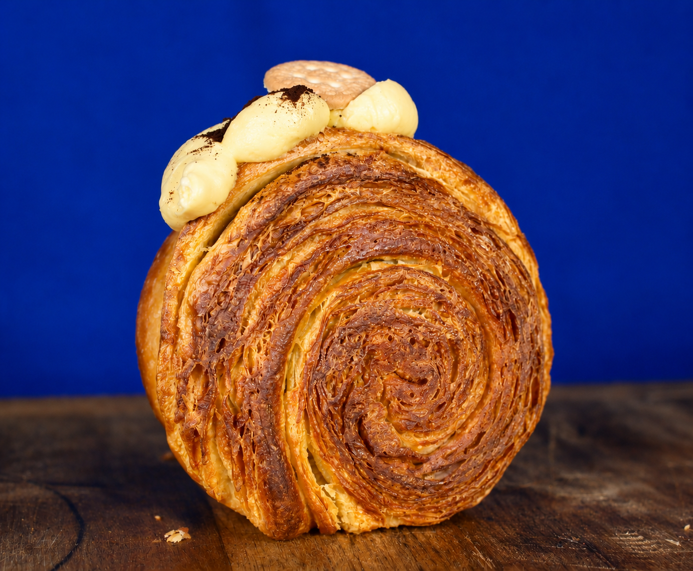 Coffee Espresso filled circular croissant with tiramisu-inspired finish close-up | Dough Couture